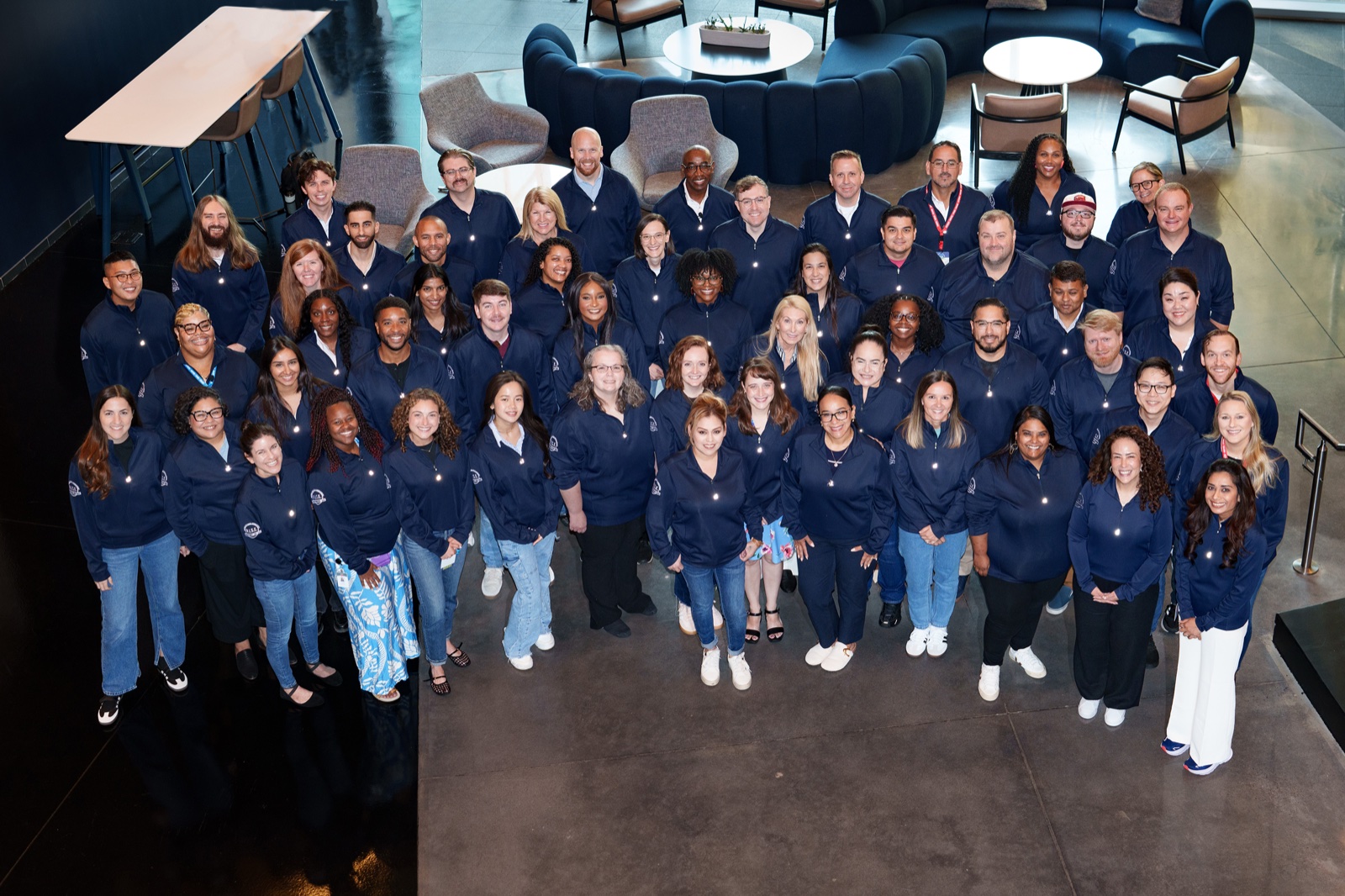 Large all hands group photograph of a company team at a corporate event in DFW