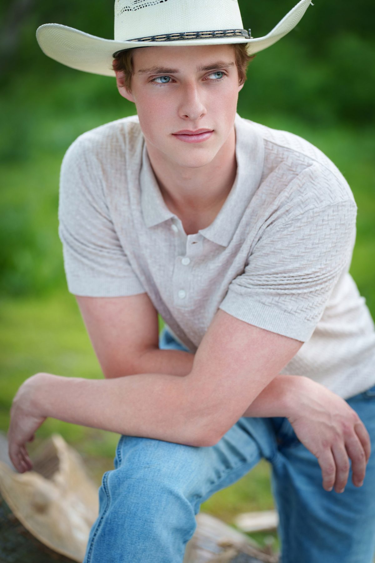Senior young man in a cowboy hat outdoors