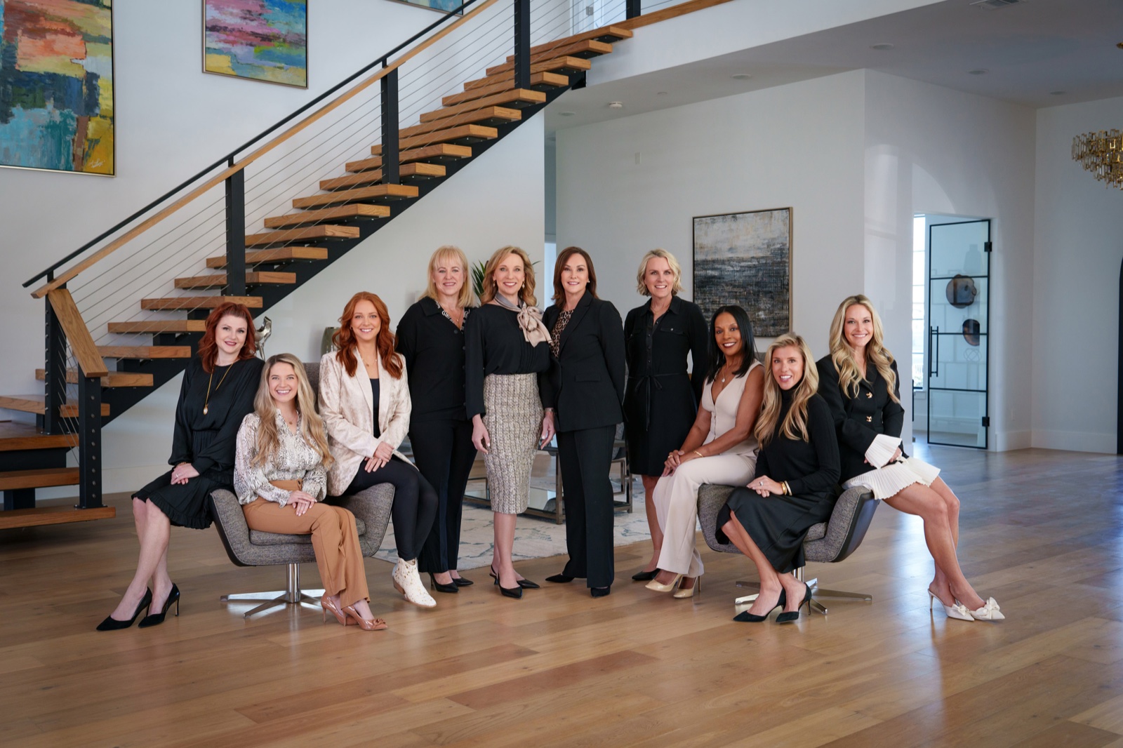 A team of twelve women photographed together in their office by Kurt Nelson, McKinney TX