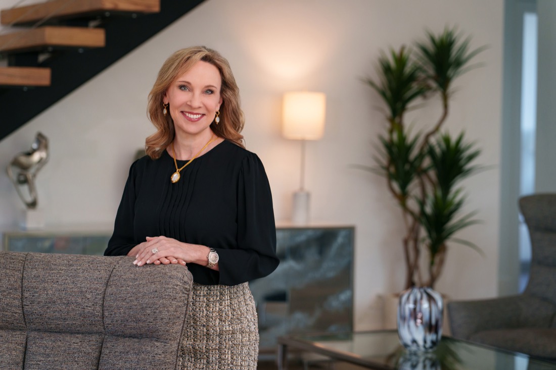 Personal branding portrait of a businesswoman in a modern home